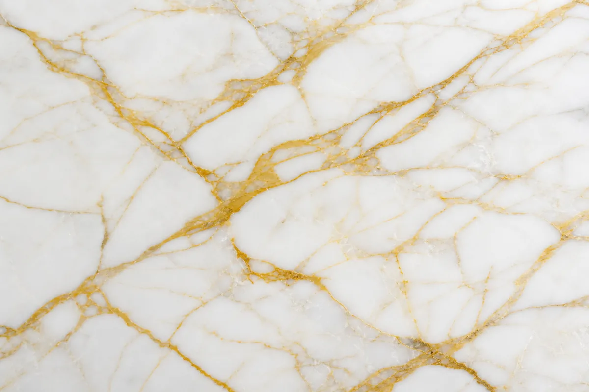Polished Calacatta Gold marble slab with golden veining