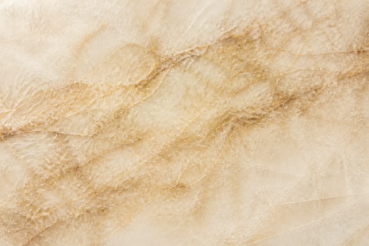 Cream Taj Mahal quartzite slab with subtle golden-brown veining